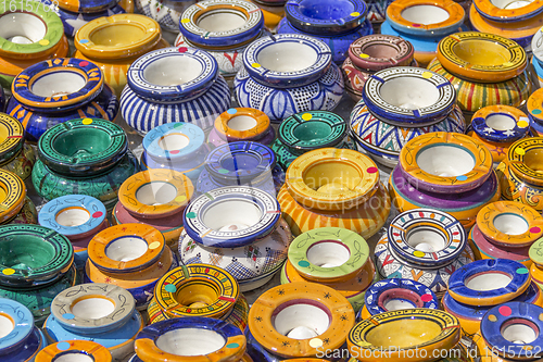 Image of lots of colorful ashtrays