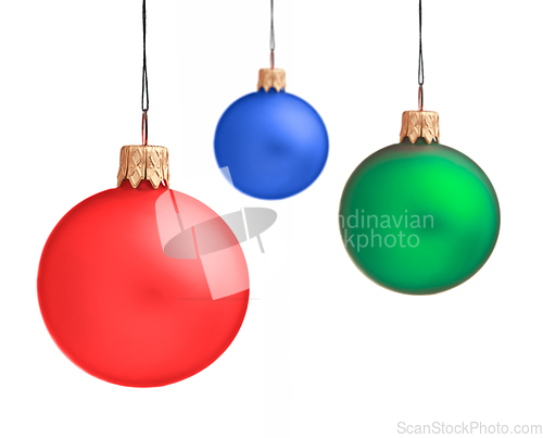 Image of Several hanging Christmas baubles isolated