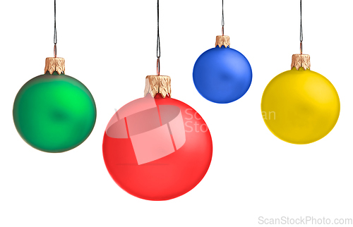 Image of Several hanging Christmas baubles isolated