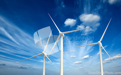 Image of Wind generator turbines in sky