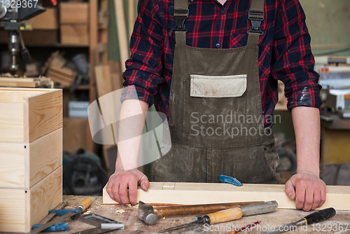 Image of Carpenter working with a chisel