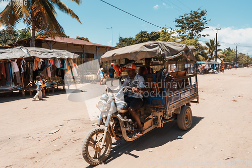 Image of Malagasy family on vehicle, Madagascar