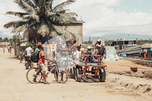 Image of Malagasy workers on main street of Maroantsetra, Madagascar