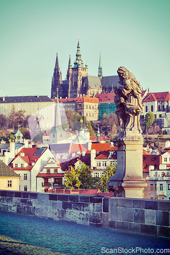 Image of Statue on Charles Brigde against St. Vitus Cathedral in Prague