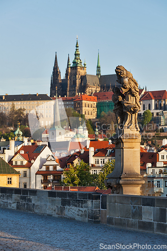 Image of Statue on Charles Brigde against St. Vitus Cathedral in Prague