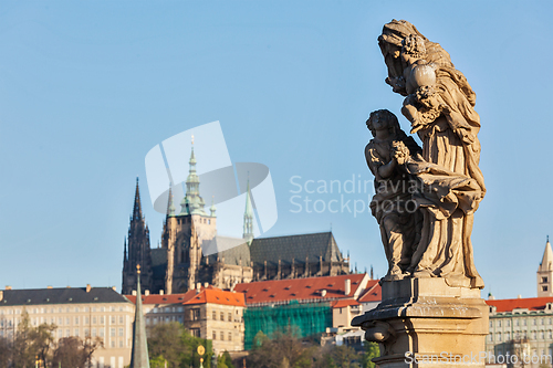 Image of Statue on Charles Brigde against St. Vitus Cathedral in Prague