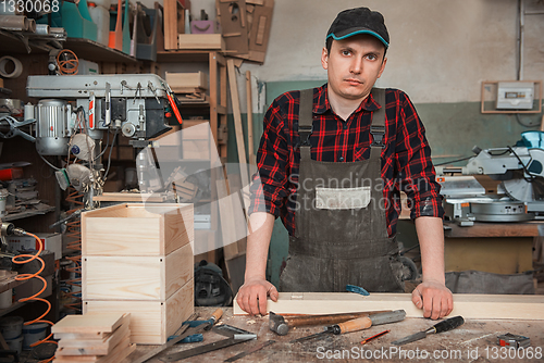 Image of Carpenter working with a chisel