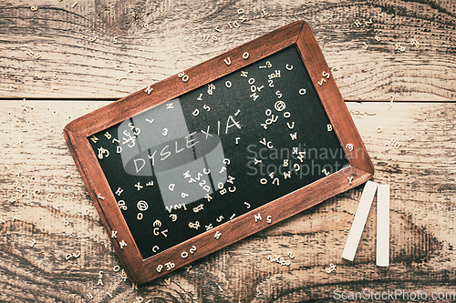 Image of Dyslexia concept, help children with reading - old school blackboard with chalk