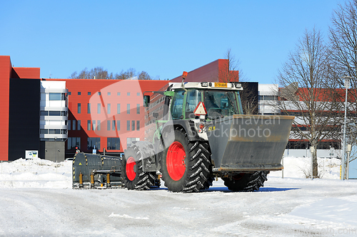 Image of Tractor Ploughing Snow and Spreading Grit