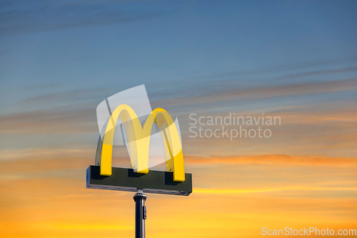 Image of McDonald's Logo Against Golden Hour Sky