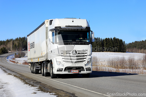 Image of White Mercedes-Benz Actros Truck Semi Trailer on Road