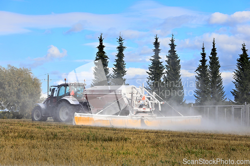 Image of Tractor Spreading Agricultural Lime in Field