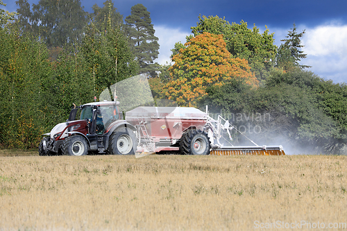 Image of Valtra Tractor Spreading Agricultural Lime in Field