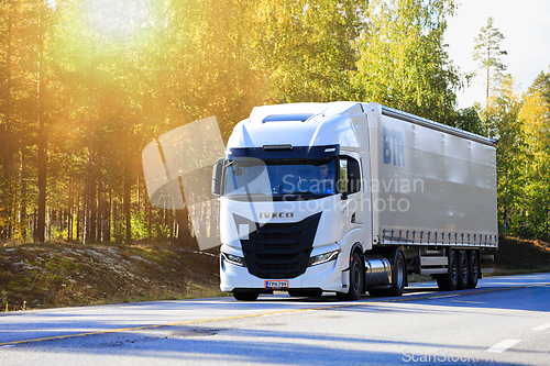 Image of White Iveco S-Way Truck Pulls Semi Trailer on Road