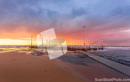 Image of Sunrise and cstorm clouds over Mona Vale Ocean pool