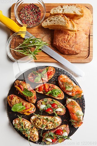 Image of Set of assorted bruschetta with various toppings for holiday. To