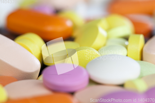 Image of different color unpacked pills