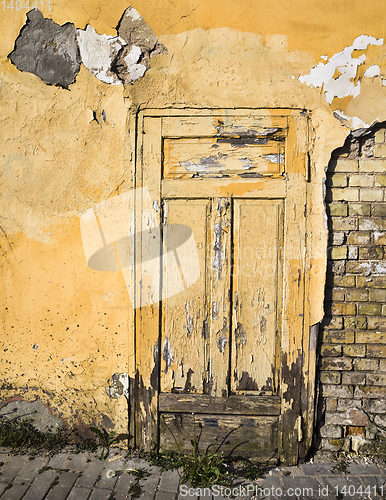 Image of closed yellow wooden door