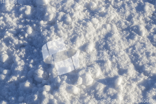 Image of Snow after snowfall - snow lying in snowdrifts after the last snowfall. Photo in the winter in the field.