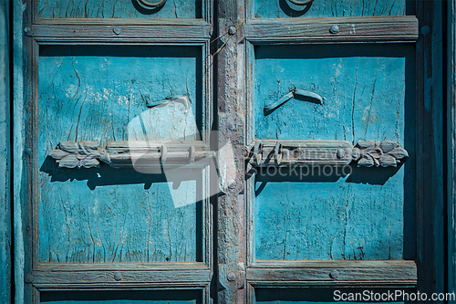 Image of Latch with padlock on door in India