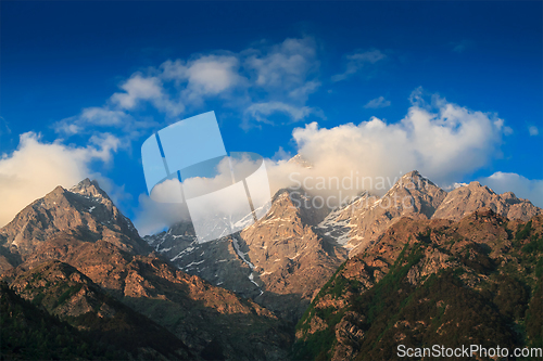 Image of Himalayas summits in clouds on sunset