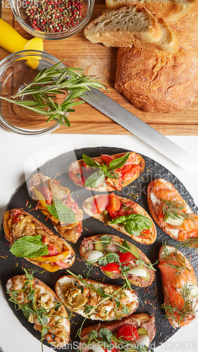 Image of Set of assorted bruschetta with various toppings for holiday. To