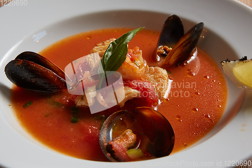 Image of Close up of a bowl of italian seafood soup