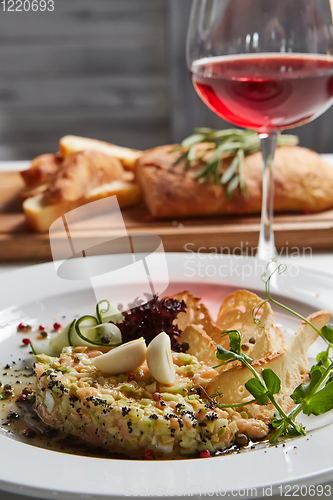 Image of The salmon tartare with avocado. Shallow dof