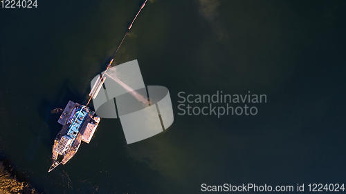 Image of On the river there are works on extraction of sand. Works dredge