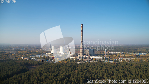 Image of The thermoelectric plant with big chimneys in forest