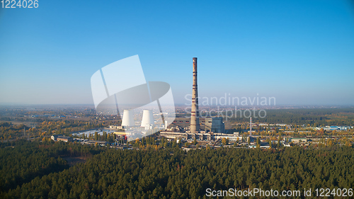 Image of The thermoelectric plant with big chimneys in forest