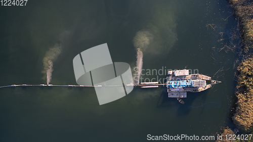 Image of On the river there are works on extraction of sand. Works dredge