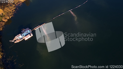 Image of On the river there are works on extraction of sand. Works dredge