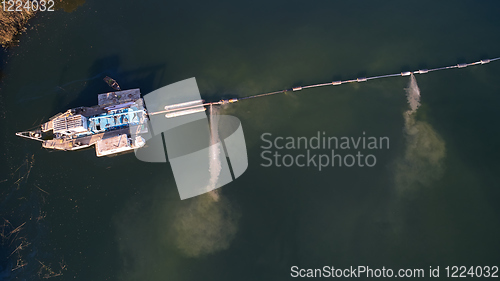 Image of On the river there are works on extraction of sand. Works dredge