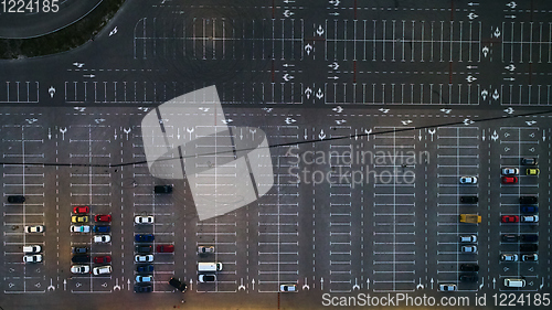 Image of Aerial top view of parking lot with many cars from above, transportation and urban concept.