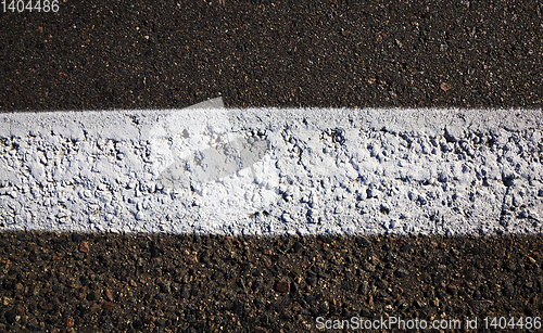 Image of white road markings asphalted