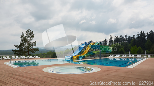 Image of swimming pool on luxury resort in forest.