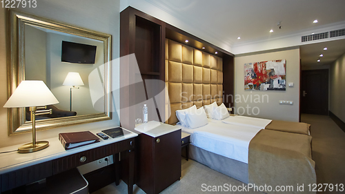 Image of Two beds in a hotel room. Interior design