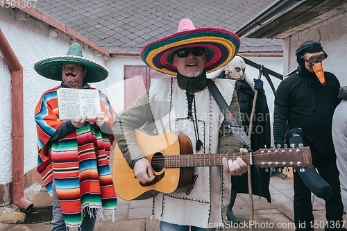 Image of People attend the Slavic Carnival Masopust