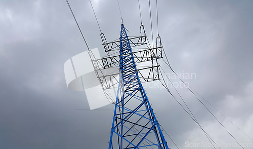 Image of High voltage tower against the cloudy sky