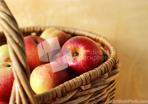 Image of Tasty ripe apples in a basket
