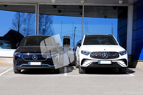 Image of Two New Mercedes-Benz Cars at a Dealership