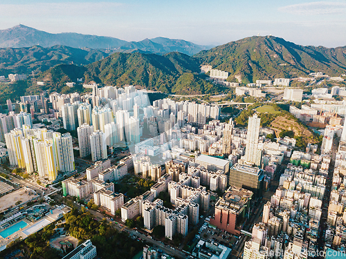 Image of Aerial city view with crossroads and roads, houses, buildings an