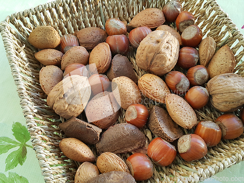Image of Various nuts in a wicker bowl
