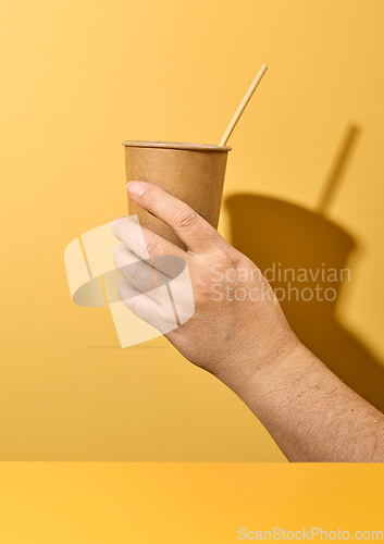 Image of take away cup in human hand
