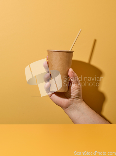 Image of take away cup in human hand