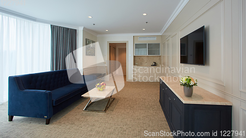 Image of A modern livingroom inside a new flat with TV.