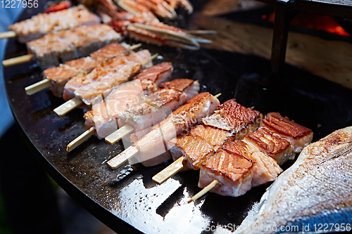 Image of Grilled fresh seafood: prawns, fish, octopus, oysters food background Barbecue Cooking BBQ