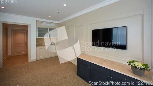 Image of A modern livingroom inside a new flat with TV.