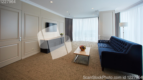 Image of A modern livingroom inside a new flat with TV.